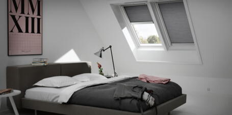 Ein Schlafzimmer mit Dachschräge und Dachfenstern | VELUX Magazin